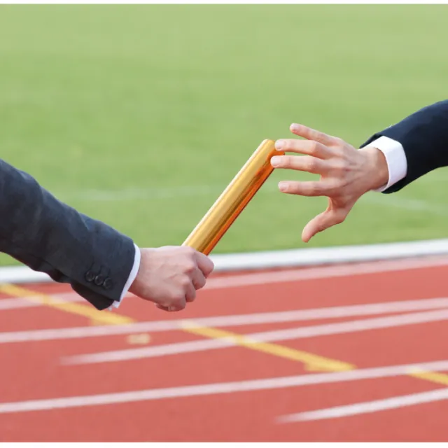 passing of a baton on a running track